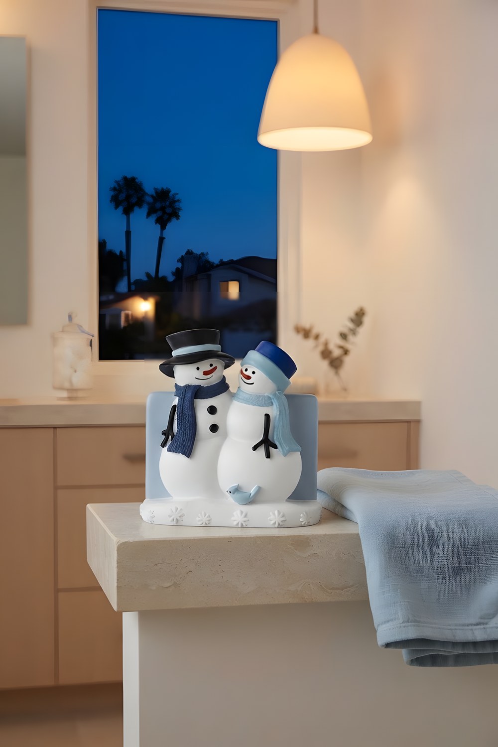 The hand towels that wait by the sink all December